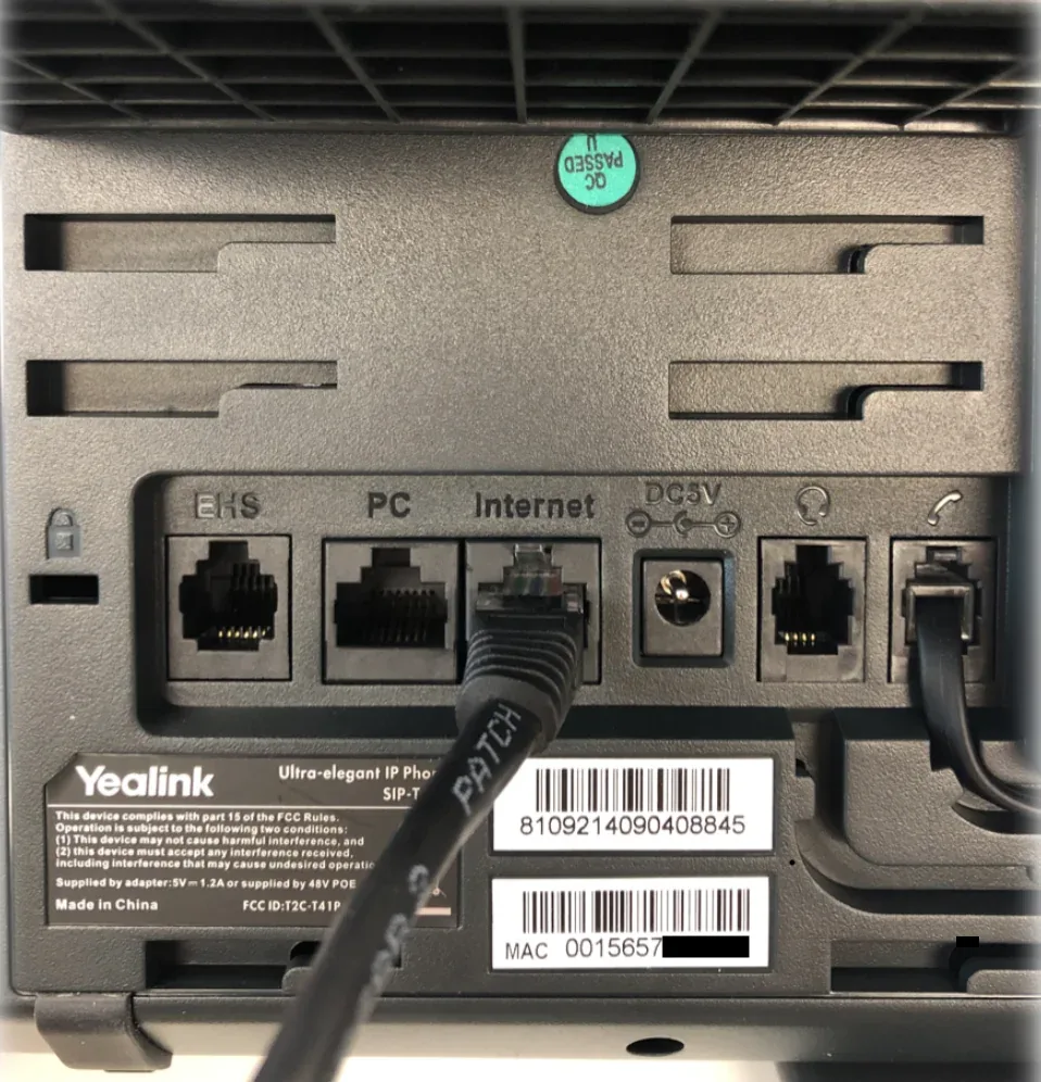Yealink phone back panel showing the Internet port, PC port, handset port, and MAC address label